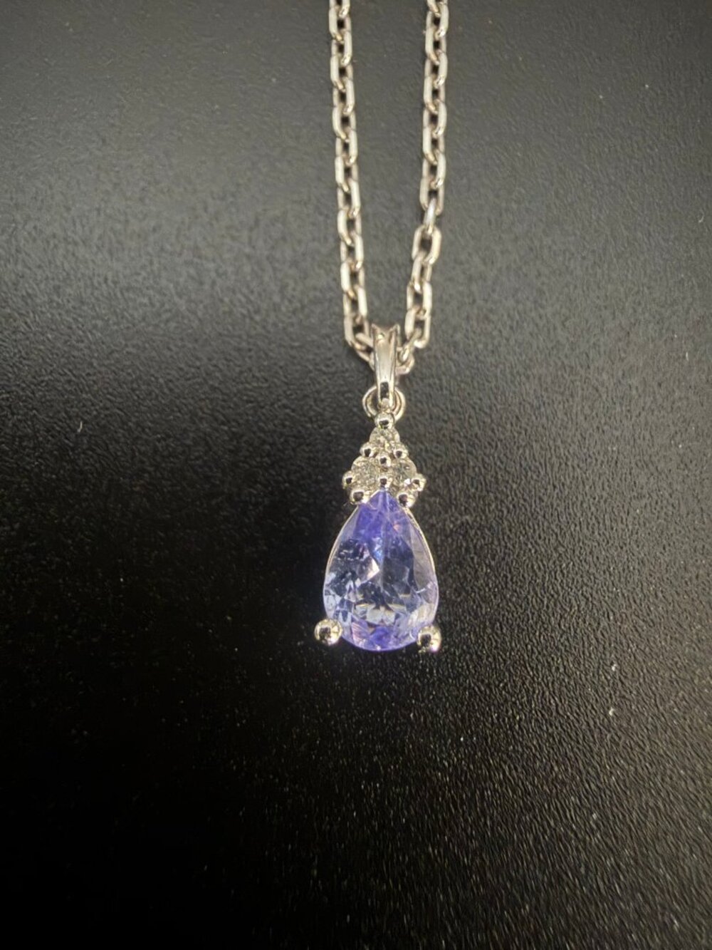 Sterling silver teardrop pendant with a genuine amethyst accented by lab created